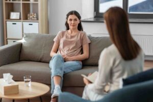 Woman speaking with a therapist during a mental health counseling session